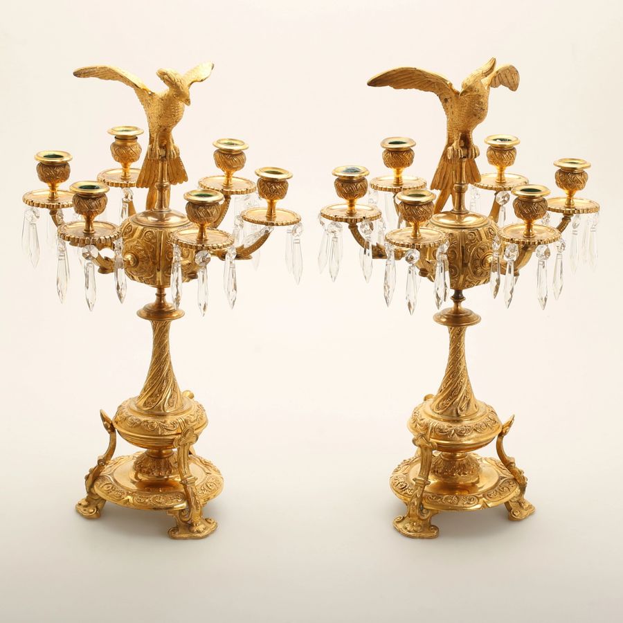 Antique Pair of candelabra with figures of birds of paradise.