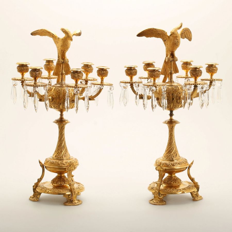 Antique Pair of candelabra with figures of birds of paradise.