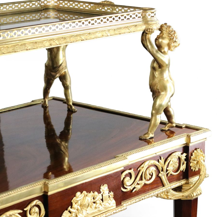 Antique Two-tier tea table with attributes in the Louis XVI style, modeled by Francois Lincke. France, late 19th century