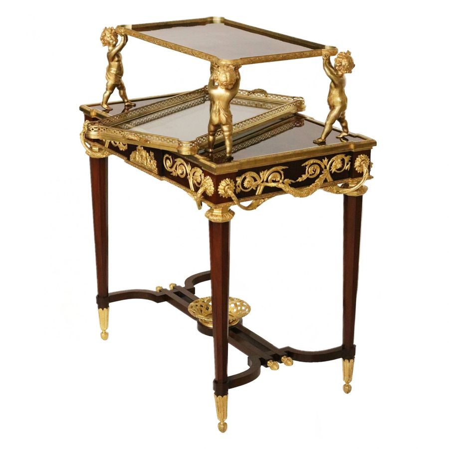 Antique Two-tier tea table with attributes in the Louis XVI style, modeled by Francois Lincke. France, late 19th century