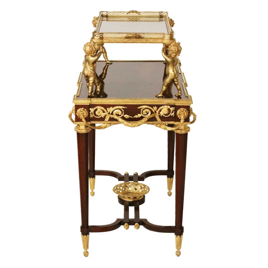 Antique Two-tier tea table with attributes in the Louis XVI style, modeled by Francois Lincke. France, late 19th century