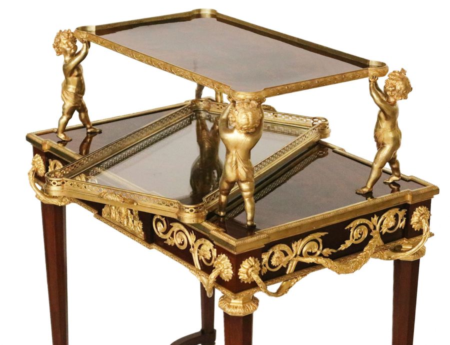 Antique Two-tier tea table with attributes in the Louis XVI style, modeled by Francois Lincke. France, late 19th century