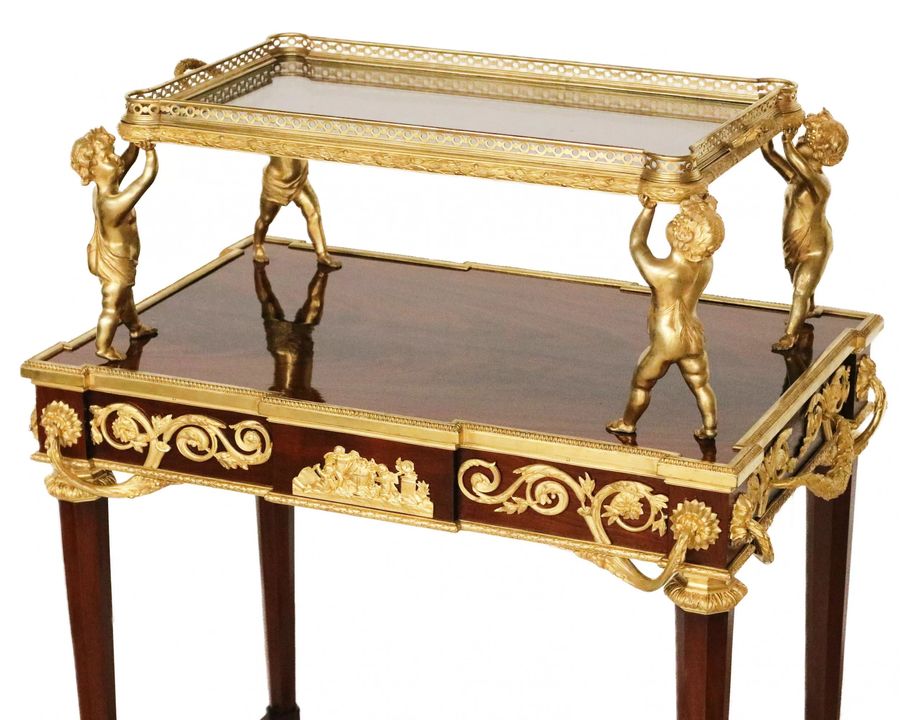 Antique Two-tier tea table with attributes in the Louis XVI style, modeled by Francois Lincke. France, late 19th century