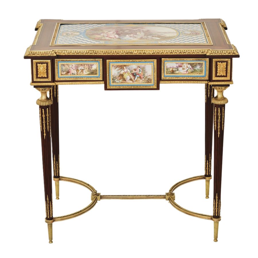 Antique A magnificent ladies table with gilded bronze decor and porcelain panels in the style of Adam Weisweiler. France. 19th century