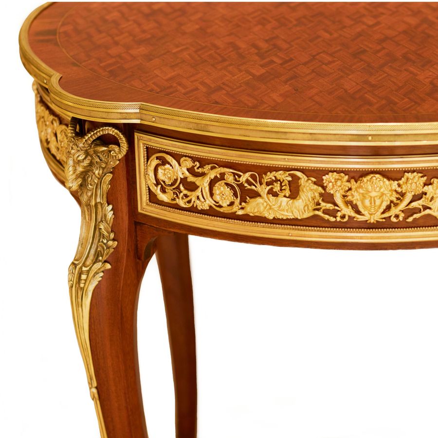 Antique Mahogany table decorated with marquetry in the style of Louis XV, Francois Linke. Late 19th century