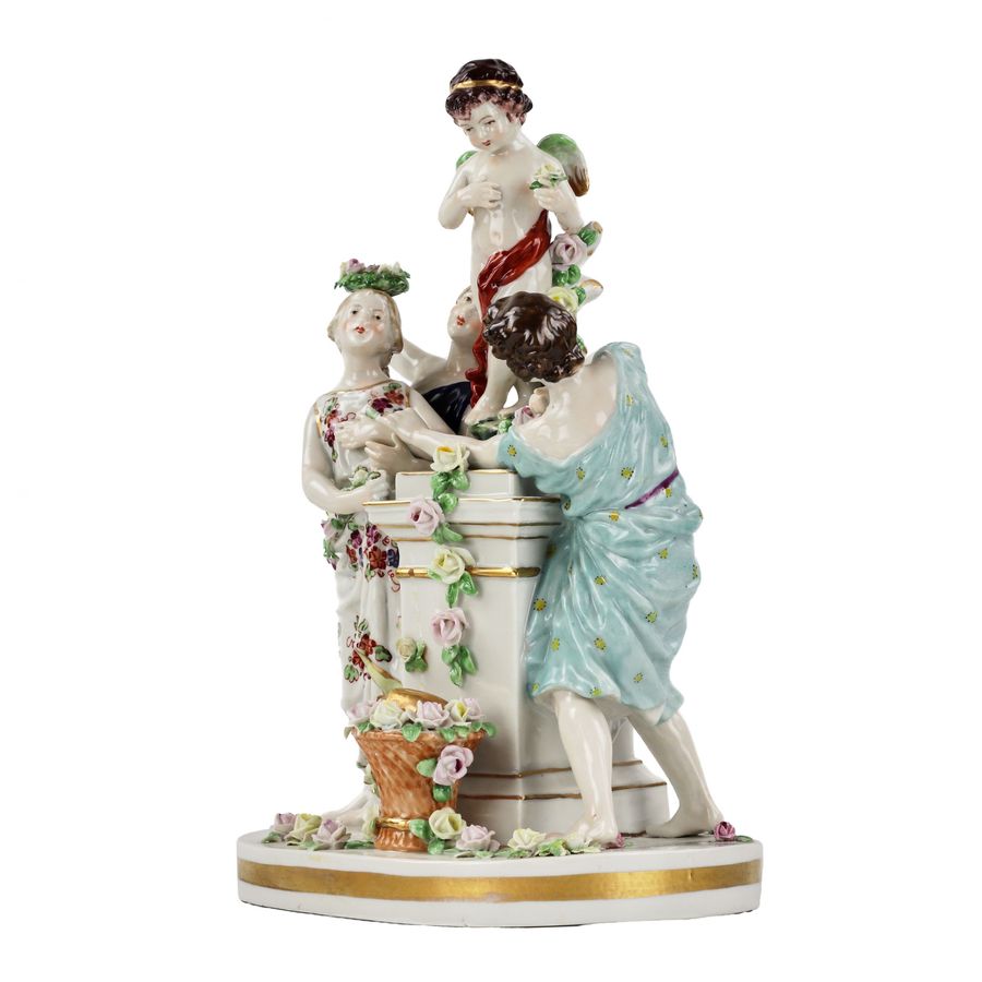 Antique Porcelain group Young people with Cupid.