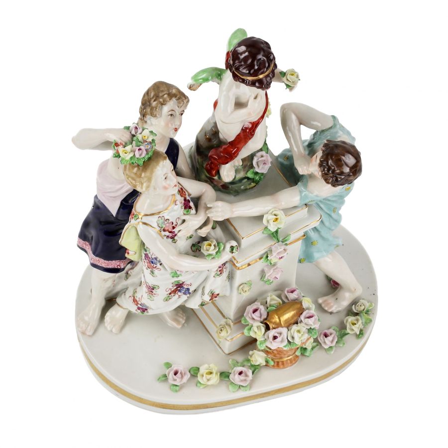 Antique Porcelain group Young people with Cupid.