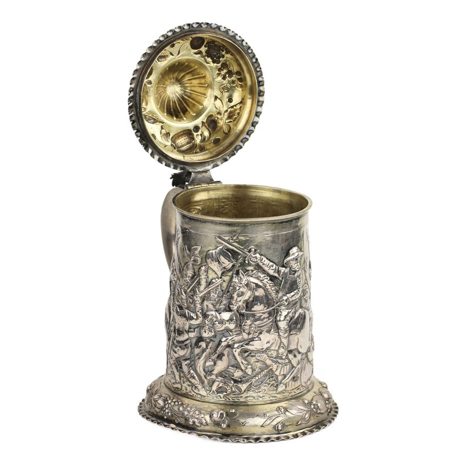 Antique Silver beer goblet with battle scenes. First half of the 19th century.