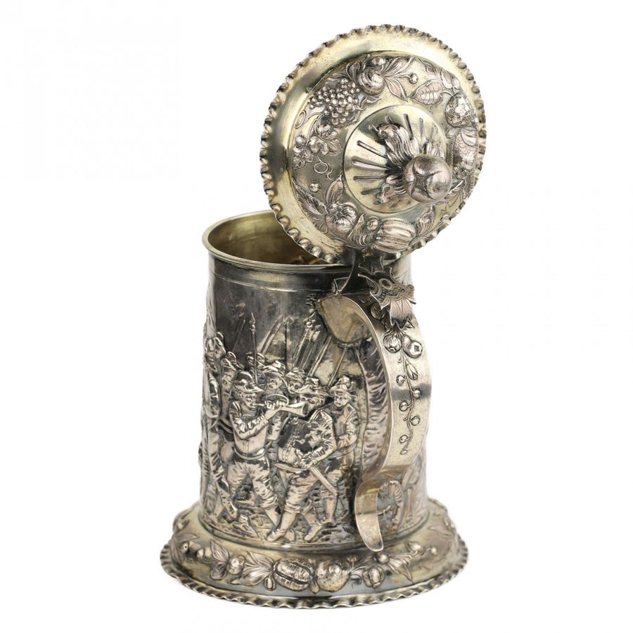 Antique Silver beer goblet with battle scenes. First half of the 19th century.