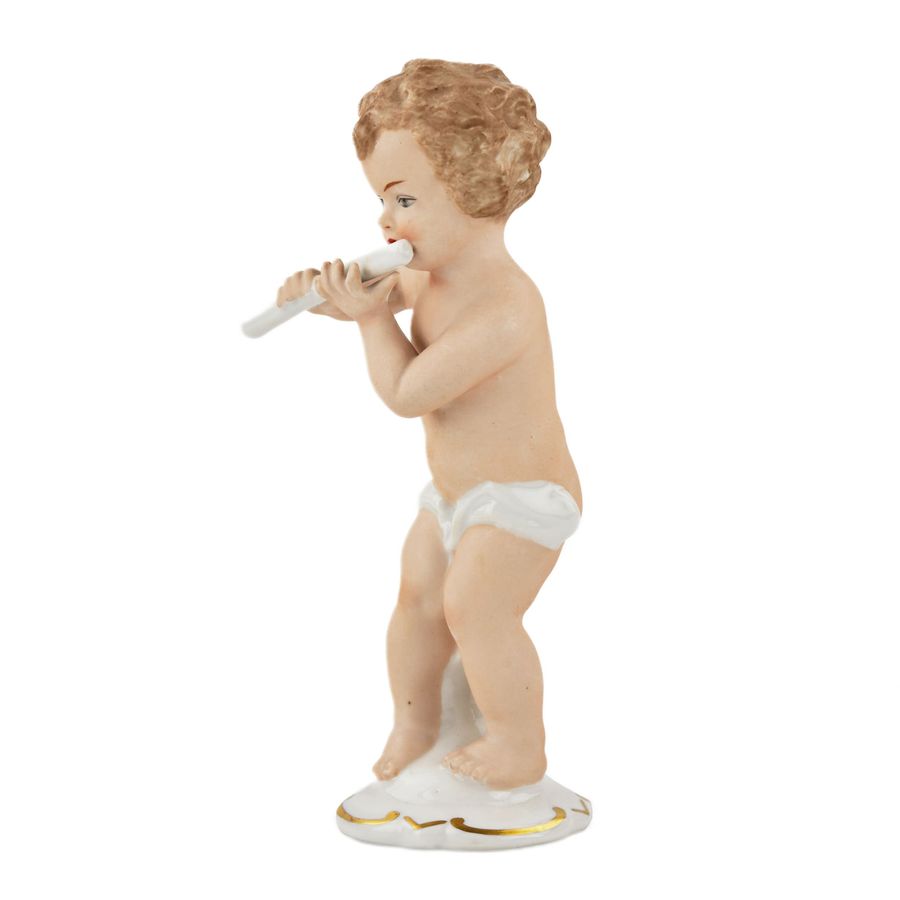 Antique Porcelain figurine Boy with a flute. Wallendorf, Germany, mid-twentieth century.