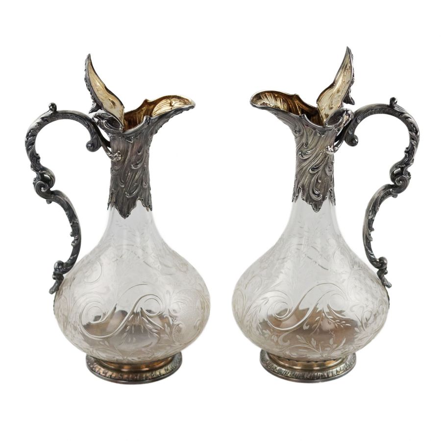 Antique Pair of wine glass jugs in silver, Louis XV style, turn of the 19th-20th centuries.