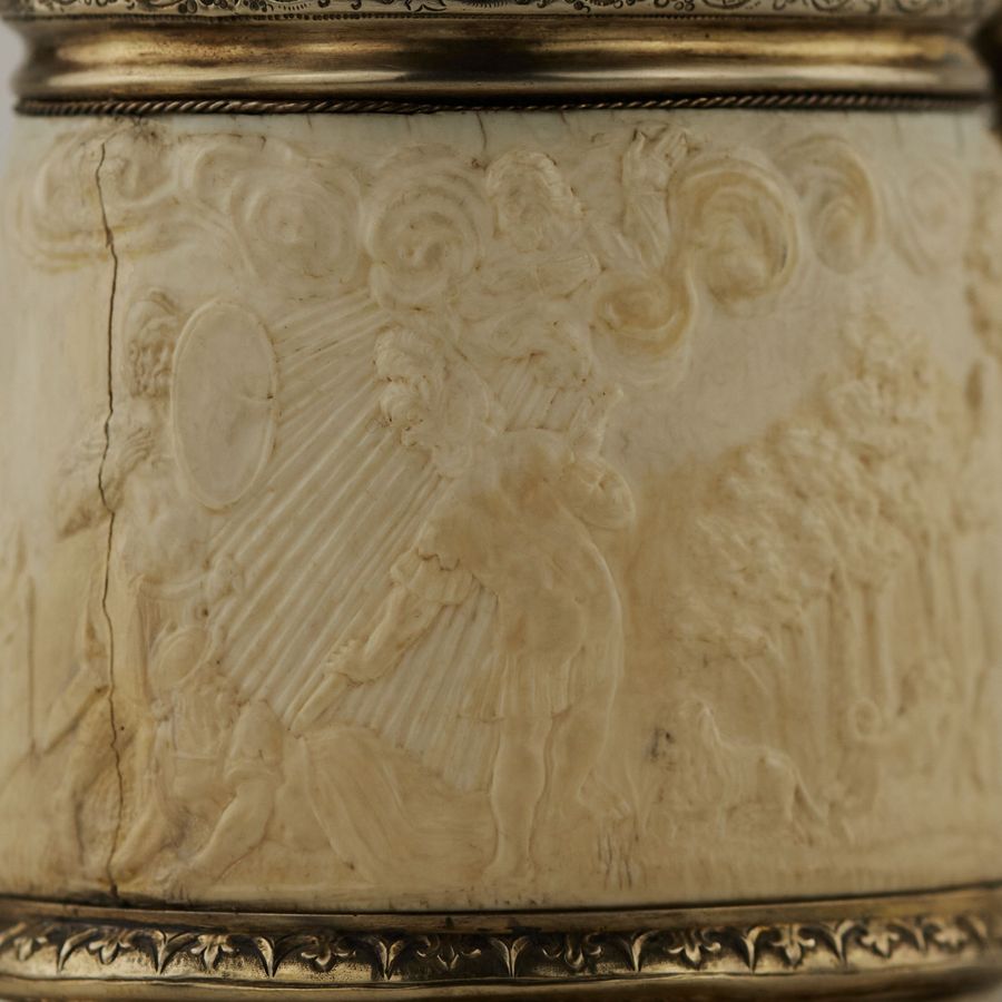 Antique Silver beer goblet with Atlas on the lid and religious scenes on ivory. Lubeck. 17th century.