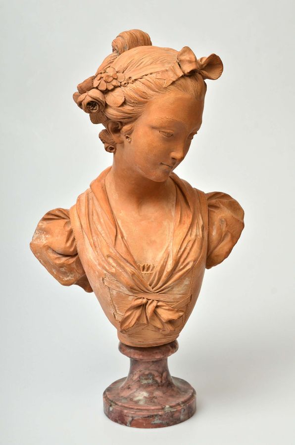 Antique Terracotta bust on a marble base Bust of a Virgin