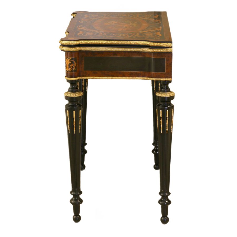 Antique Gaming table decorated with a pattern using marquetry technique. France. Late 19th century