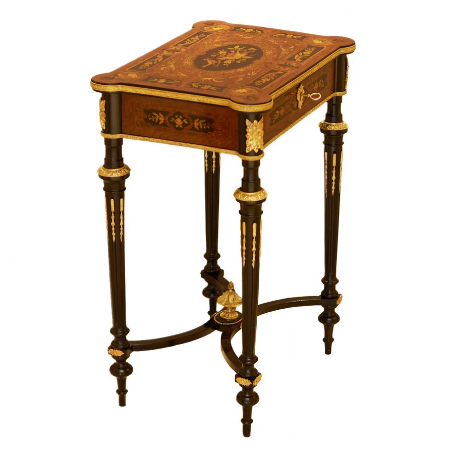 Antique A lovely inlaid wood dressing table with gilded bronze. France late 19th century.