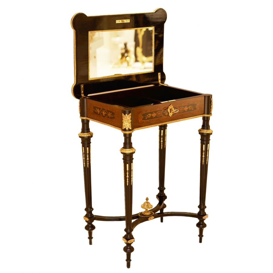 Antique A lovely inlaid wood dressing table with gilded bronze. France late 19th century.