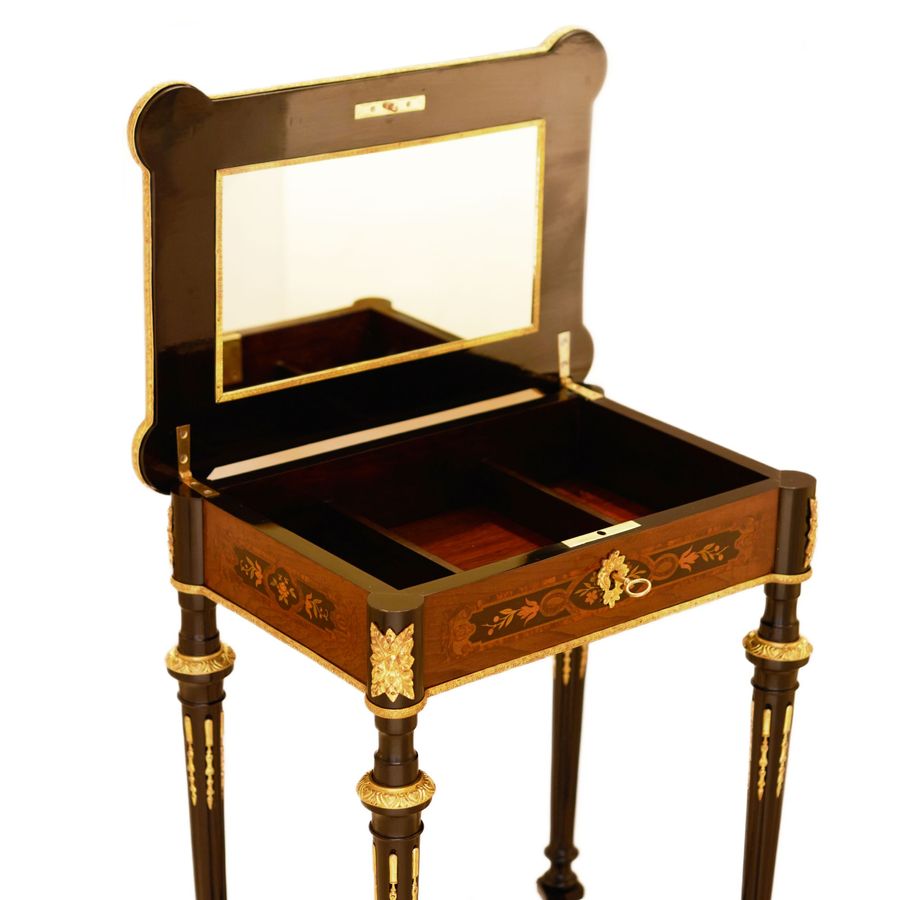 Antique A lovely inlaid wood dressing table with gilded bronze. France late 19th century.