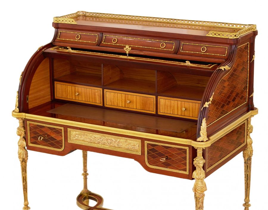 Antique E.KAHN. A magnificent cylindrical bureau in mahogany and satin wood with gilt bronze.