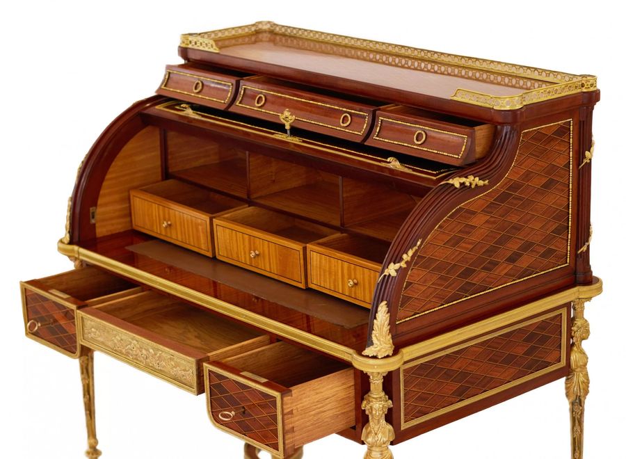 Antique E.KAHN. A magnificent cylindrical bureau in mahogany and satin wood with gilt bronze.