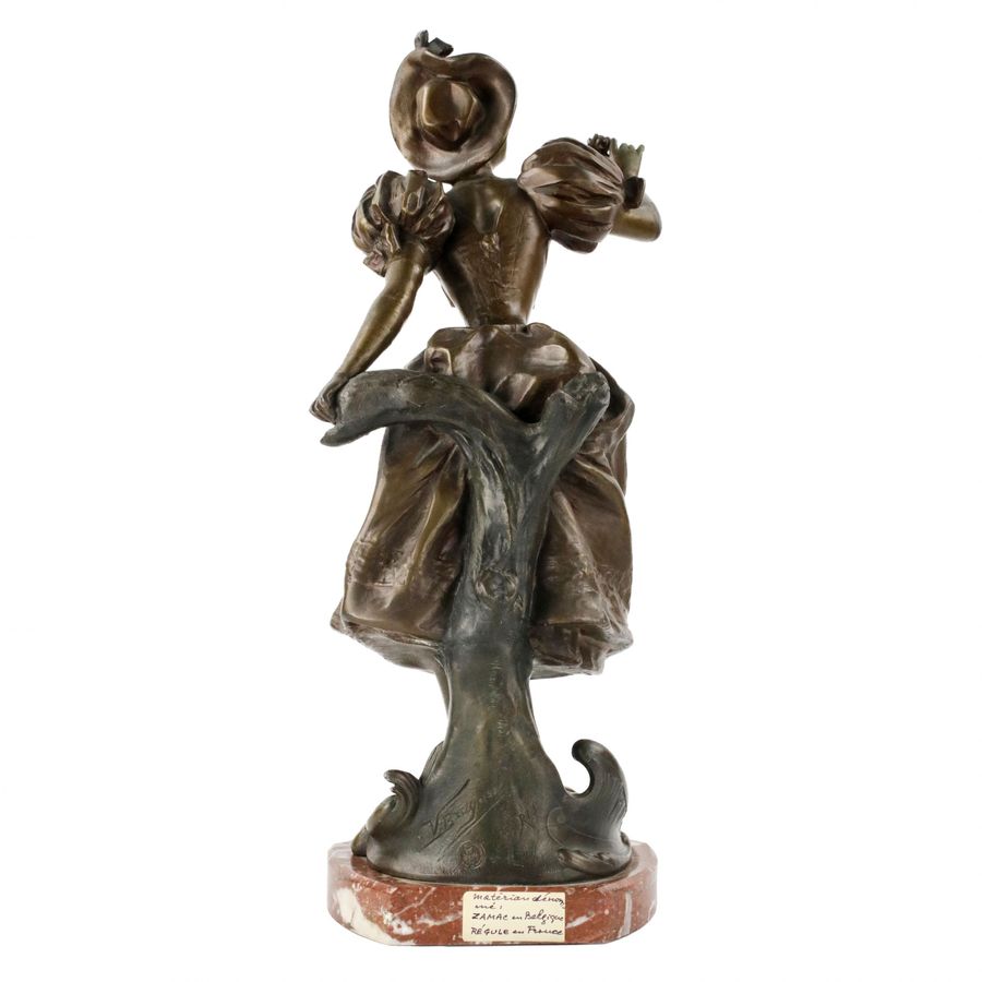 Antique French, bronzed metal figure on a marble base. Happy holiday.