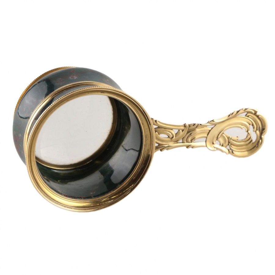 Antique Magnifier in gold frame.