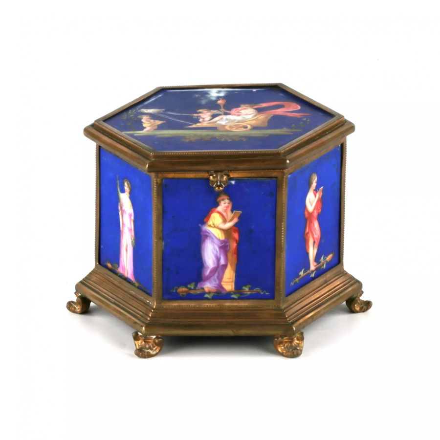 Brass box with muses, on porcelain panels.