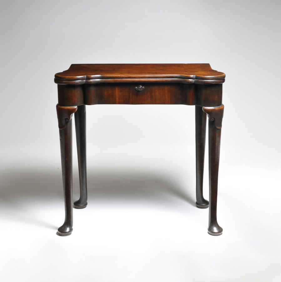 A George II Mahogany Tea Table of small proportions.