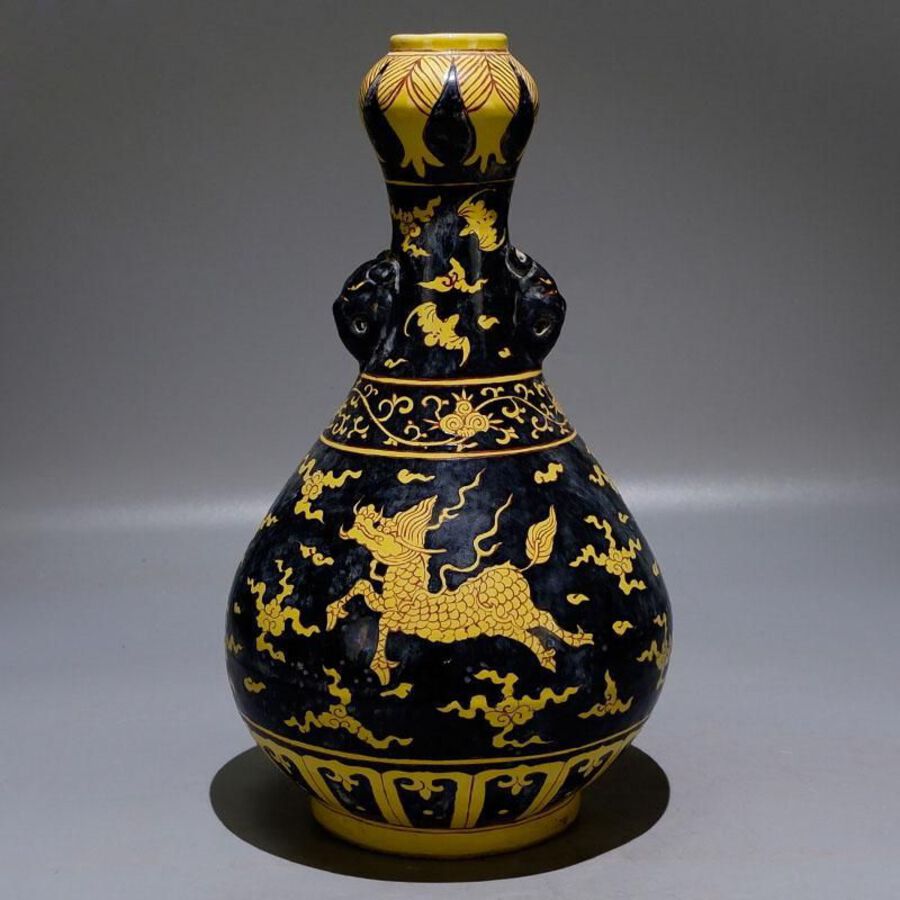 Black and yellow painted garlic vase with unicorn motif