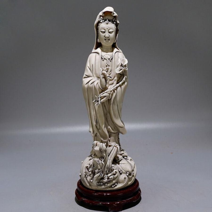 Antique White glazed lotus-bearing Goddess of Mercy | ANTIQUES.CO.UK