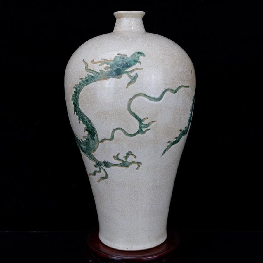 White glaze carved plum vase with dragon pattern