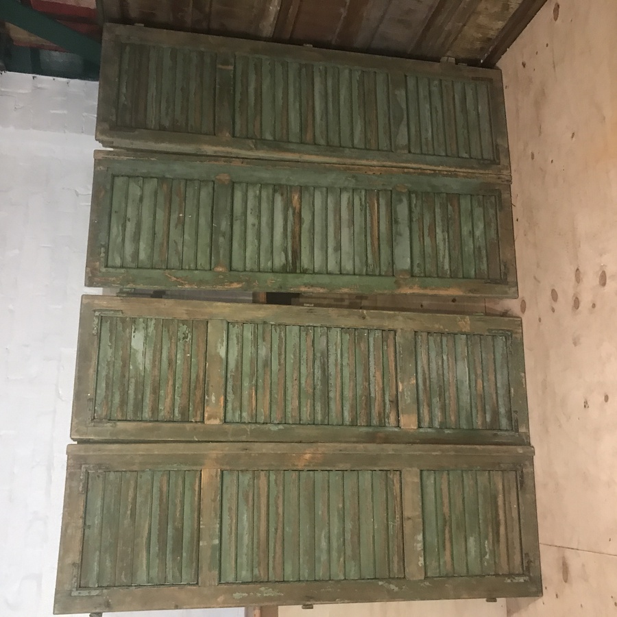 TWO PAIRS OF ANTIQUE FRENCH SHUTTERS IN THE ORIGINAL PAINT