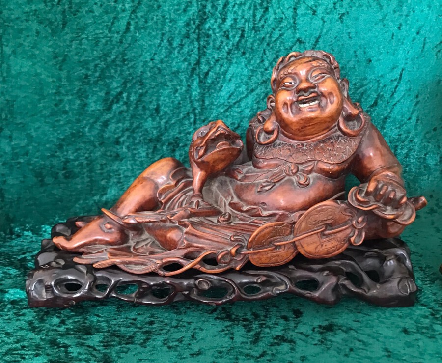 An Amusing Reclining Figure Of A Corpulent Buddha. Chinese.  Sculpture. Circa 1900