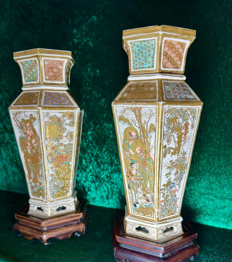 A pair of 6 panel Japanese vases