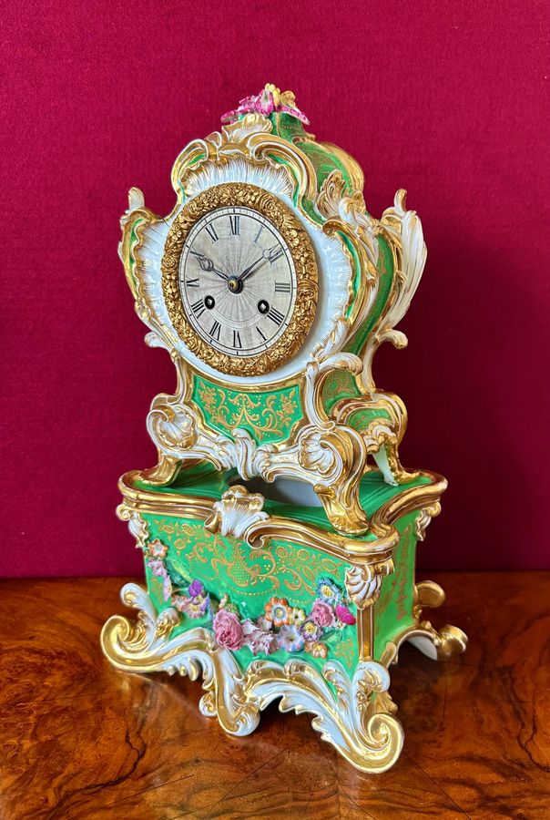 An early 19th century porcelain French mantle clock, circa 1840