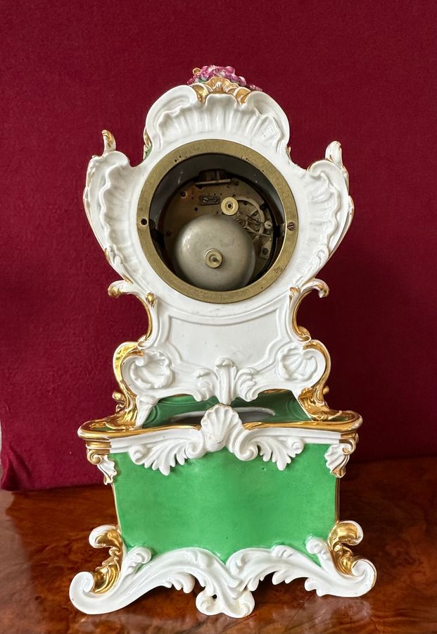 Antique An early 19th century porcelain French mantle clock, circa 1840