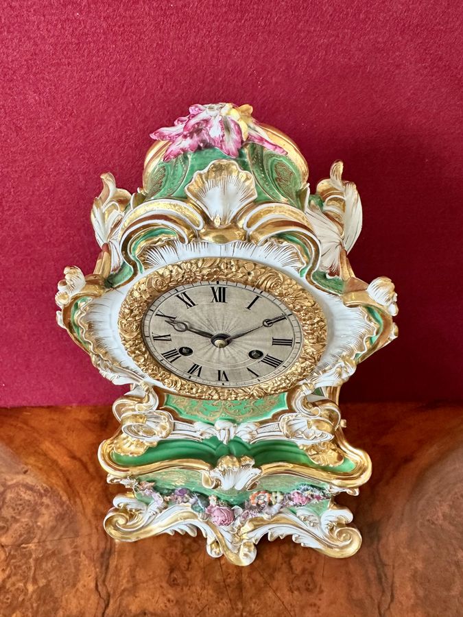 Antique An early 19th century porcelain French mantle clock, circa 1840