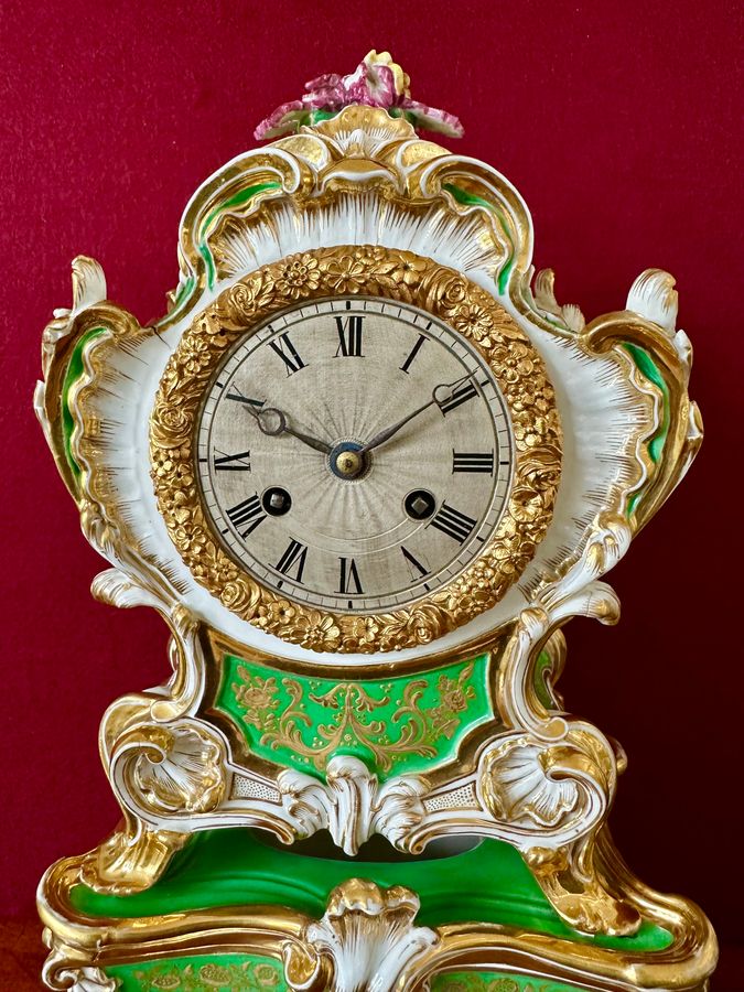 Antique An early 19th century porcelain French mantle clock, circa 1840