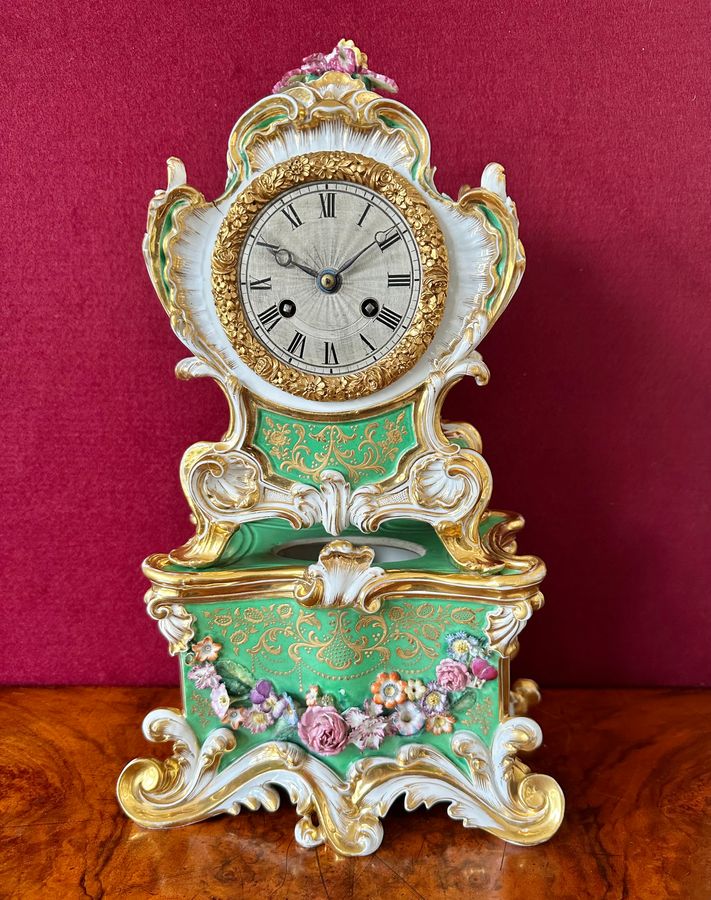 Antique An early 19th century porcelain French mantle clock, circa 1840