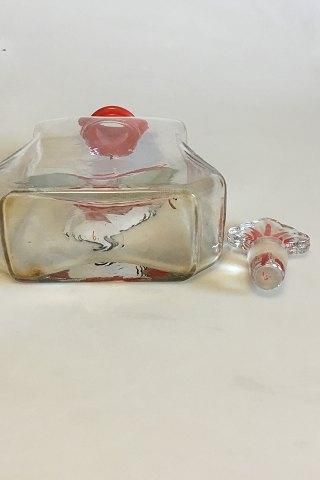 Antique Christmas carafe with 8 small glasses. Decorated with Santa Claus. The Carafe is spherical grinded at the bottom and labeled 