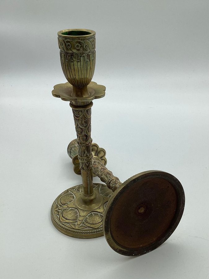 Antique Pair of brass candlesticks with art deco decorations in relief ca. 1920