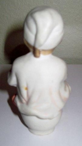 Antique Porcelain Figurine of a little boy on the pot