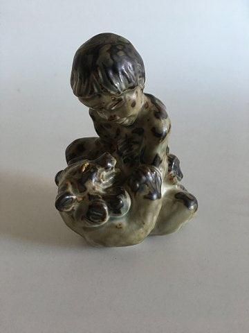 Antique Royal Copenhagen Stoneware Figurine of a child with a bear No 20245