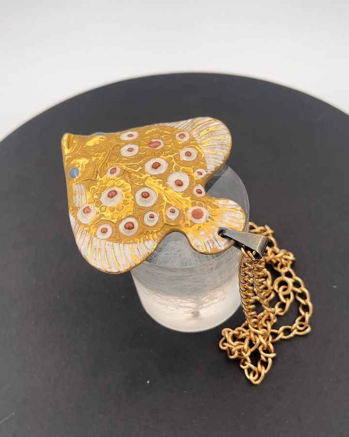 Antique Royal Copenhagen Pendant of porcelain shaped and decorated as a Flounder. Designed by Nils Thorson. Sterling Silver by Anton Michelsen
