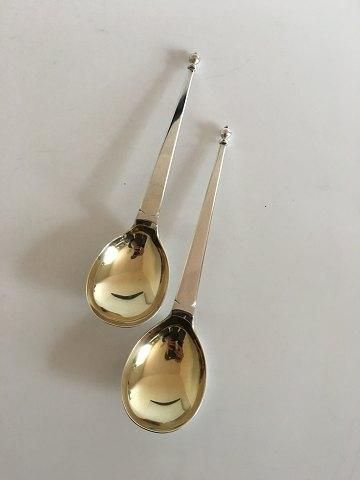 Antique Set of two serving spoons in English Silver, partly gilded.