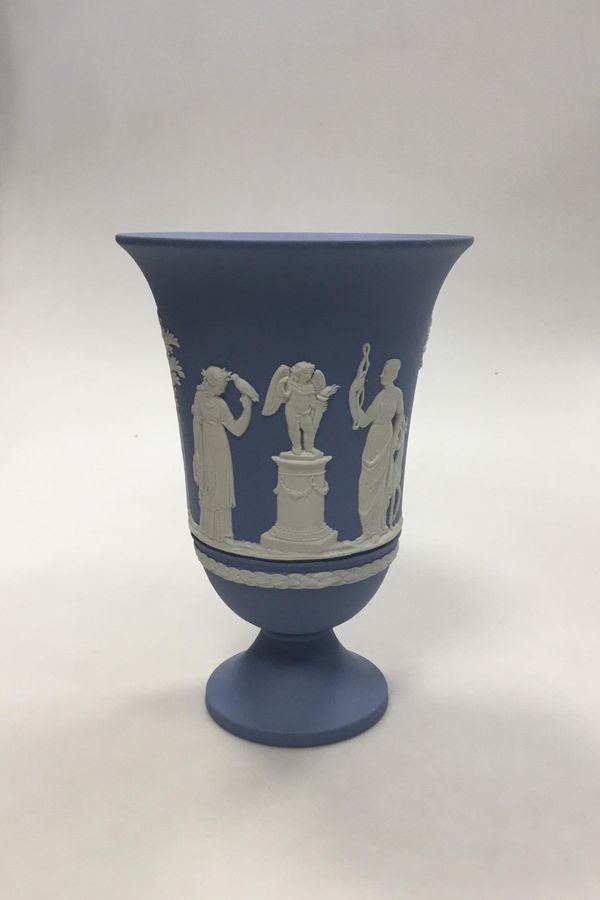 Antique Wedgewood Blue vase on foot with decorated with sacrificial vessel and Cupid. Measures 19 cm (7 31/64 in.)