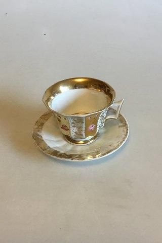 Antique Faceted coffee cup decorated with roses and gold. Probably German