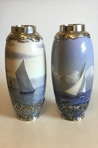 Royal Copenhagen Art Nouveau A pair of vases decorated with ship motifs and Sterling Silver Ornaments Stamped Michelsen ER 1916 No 1438/763 and 1462/763