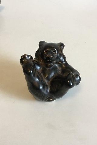 Royal Copenhagen Stoneware Figurine Brown bear cub on the back with paw against paw No 22747