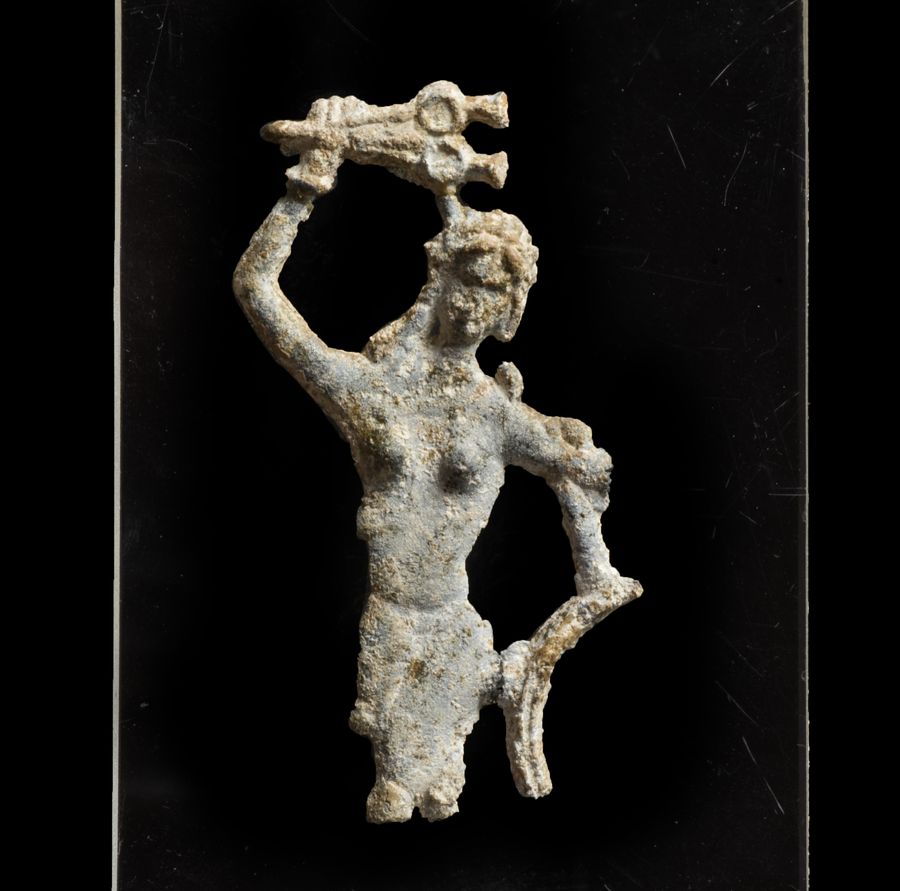 A Roman lead mirror fragment of a dancer