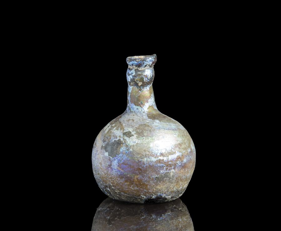 Ancient Roman glass cosmetics flask with pretty iridescence